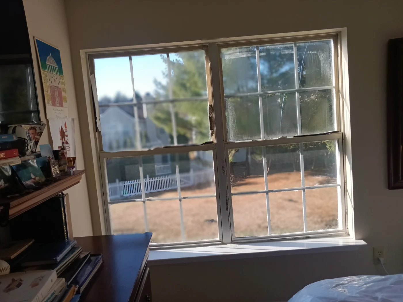 Close inside view of two old windows in Janice and Richard T.’s home before their replacement